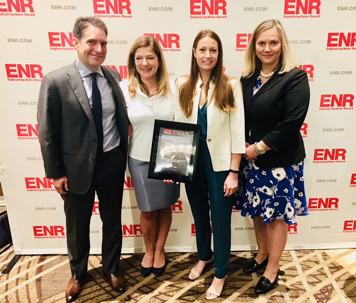 Linda Durand accepted the ENR’s Southeast Best Overall Regional Project of the Year Award alongside (from left) co-founders Richard Miles and Phoebe Miles and Executive Director Stephanie Bailes.