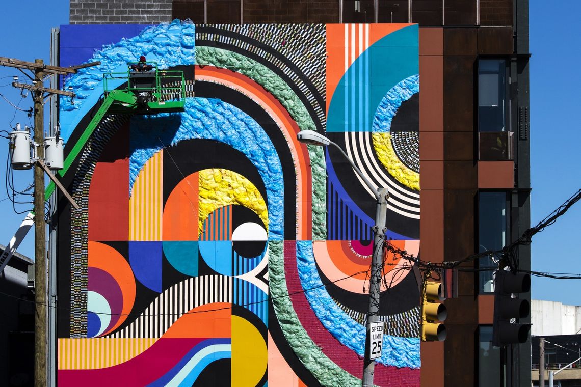 MICA Films Video of Mural Installation at Dolphin Design Center