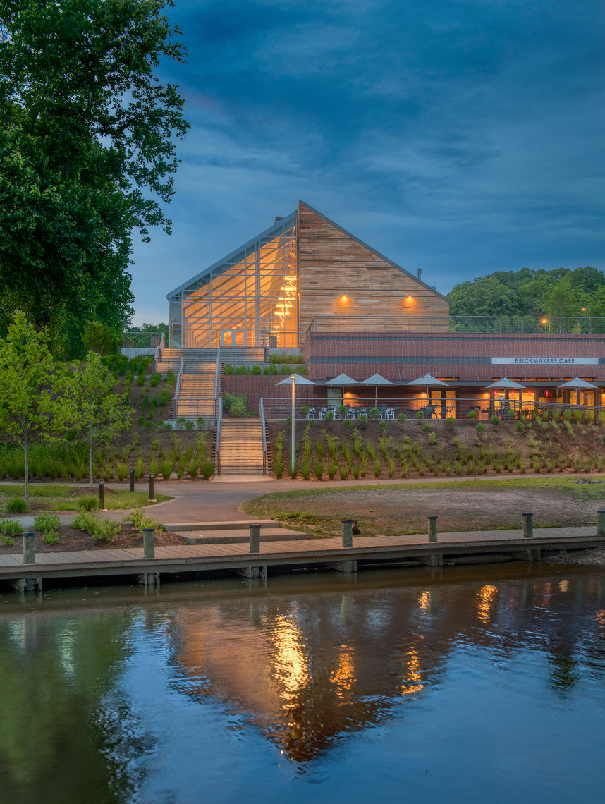 Contributing design features of the Jean R. Packard Occoquan Center include expanses of curtainwall that afford visitors and employees a connection to the outdoors and the use of river-recovered heart cypress, a species native to the area and harvested from the bottom of the river, as the building’s timber and wood cladding.