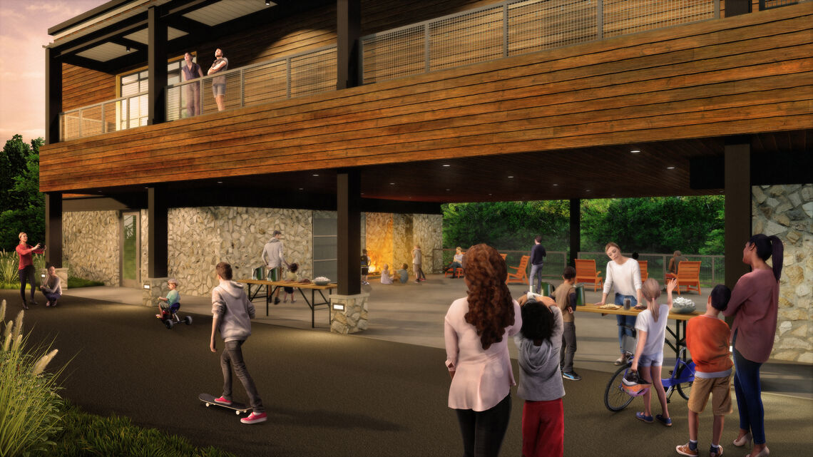 A new breezeway provides flexible, covered outdoor gathering space overlooking the wetlands and features a fireplace for story time and smores.