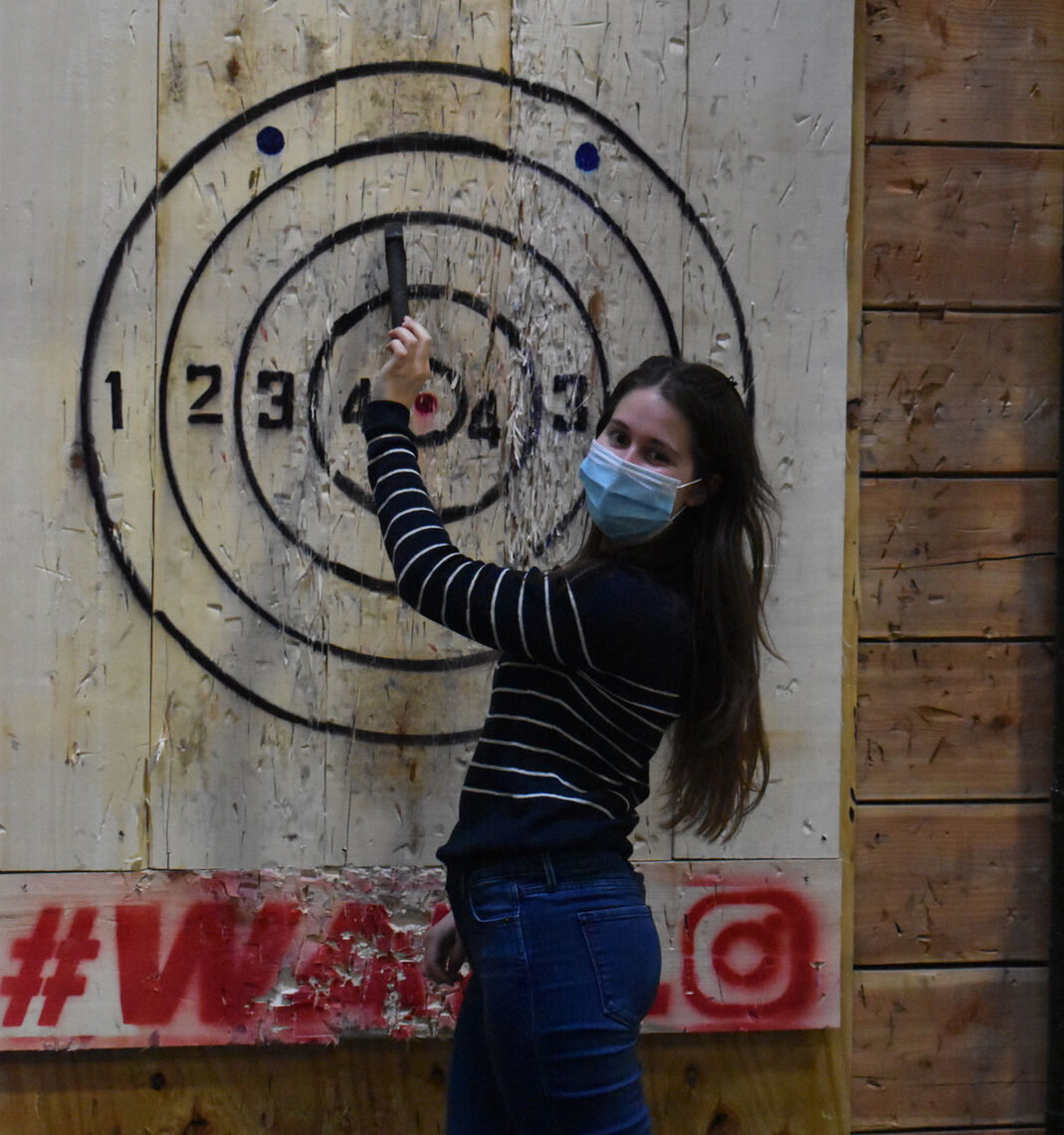 Elise Adams was an axe-throwing champ at GWWO’s annual holiday celebration.