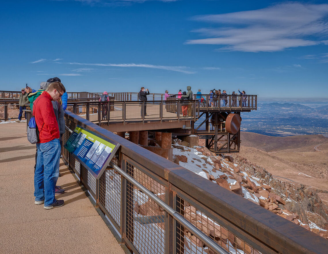 With two roof decks, an elevated viewing platform, and a network of protected walkways, the new visitor center stages a series of accessible opportunities to experience the drama of Pikes Peak.