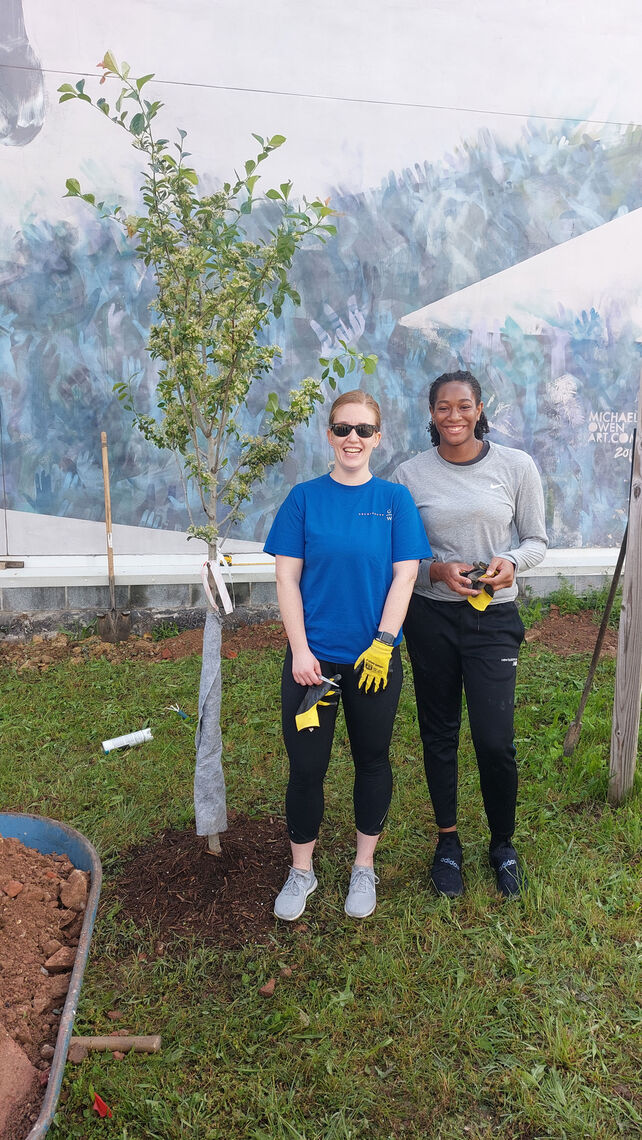 Danielle Peters (left) and Nia Young (right) help to create a new community garden.